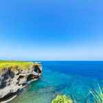 This is a photo of the sea in Okinawa, Japan, with blue sky and blue sea.